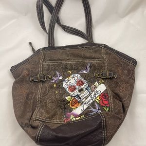 Marc Ecko brown canvas travel bag with cool skeleton design on the front.